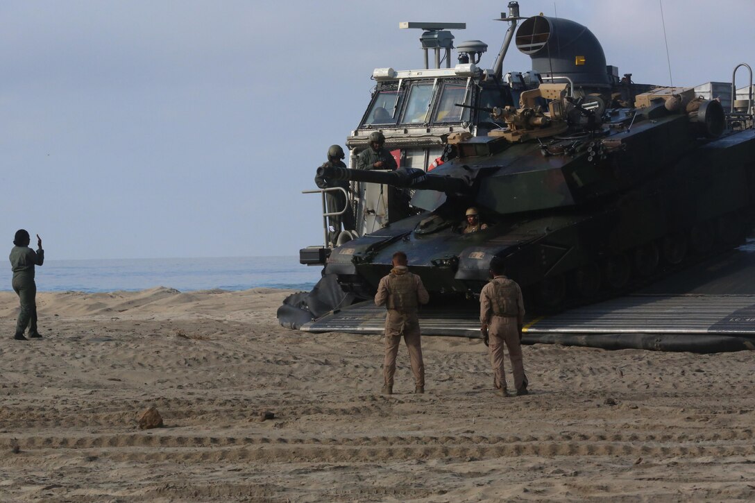 A Marine with 1st Tank Battalion, 1st Marine Division drives an M1A1 Abrams tank off of a Landing Craft Air Cushion with Assault Craft Unit 5 during the amphibious assault training portion of a Marine Corps Combat Readiness Evaluation on Camp Pendleton, Calif., August 2, 2016. During a MCCRE, Marines perform various events to determine the combat readiness of the unit. The LCAC is the only vehicle capable of transporting an M1A1 Abrams tank from an amphibious ship to land. (U.S. Marine Corps photo by Lance Cpl. Shellie Hall)