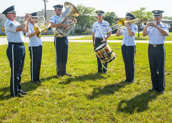Airmen from the Band of Flight perform during the National Air and Space Intelligence Center retreat ceremony at Wright-Patterson Air Force Base, Ohio, Aug. 1, 2016. Retreat ceremonies serve a twofold purpose to signal the end of the official duty day and to pay respect to our nation's flag. Because the time for the end of the duty day varies, the commander designates the specific time for the retreat ceremony. (U.S. Air force photo/Tech. Sgt. Eunique P. Thomas)
