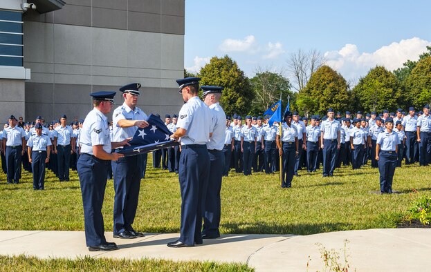 Airmen from the National Air and Space Intelligence Center participate in a retreat ceremony at Wright-Patterson Air Force Base, Ohio, Aug. 1, 2016. Retreat ceremonies serve a twofold purpose to signal the end of the official duty day and to pay respect to our nation's flag. Because the time for the end of the duty day varies, the commander designates the specific time for the retreat ceremony. (U.S. Air force photo/Tech. Sgt. Eunique P. Thomas)
