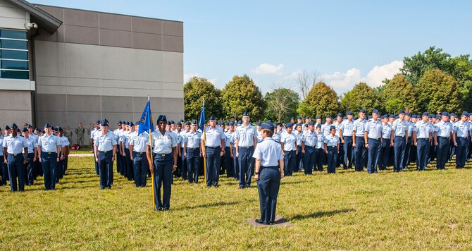Airmen from the National Air and Space Intelligence Center participate in a retreat ceremony at Wright-Patterson Air Force Base, Ohio, Aug. 1, 2016. Retreat ceremonies serve a twofold purpose to signal the end of the official duty day and to pay respect to our nation's flag. Because the time for the end of the duty day varies, the commander designates the specific time for the retreat ceremony. (U.S. Air force photo/Tech. Sgt. Eunique P. Thomas)