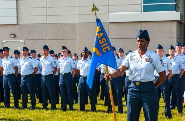 Airmen from the National Air and Space Intelligence Center participate in a retreat ceremony at Wright-Patterson Air Force Base, Ohio, Aug. 1, 2016. Retreat ceremonies serve a twofold purpose to signal the end of the official duty day and to pay respect to our nation's flag. Because the time for the end of the duty day varies, the commander designates the specific time for the retreat ceremony. (U.S. Air force photo by Tech. Sgt. Eunique P. Thomas)