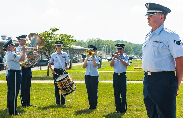 Airmen from the Band of Flight perform during the National Air and Space Intelligence Center retreat ceremony at Wright-Patterson Air Force Base, Ohio, Aug. 1, 2016. Retreat ceremonies serve a twofold purpose to signal the end of the official duty day and to pay respect to our nation's flag. Because the time for the end of the duty day varies, the commander designates the specific time for the retreat ceremony. (U.S. Air force photo/Tech. Sgt. Eunique P. Thomas)