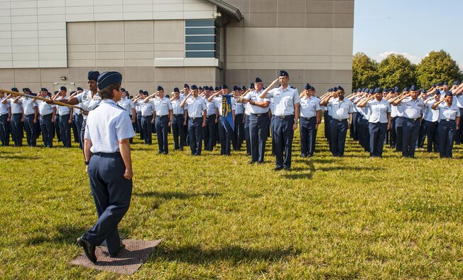 Airmen from the National Air and Space Intelligence Center participate in a retreat ceremony at Wright-Patterson Air Force Base, Ohio, Aug. 1, 2016. Retreat ceremonies serve a twofold purpose to signal the end of the official duty day and to pay respect to our nation's flag. Because the time for the end of the duty day varies, the commander designates the specific time for the retreat ceremony. (U.S. Air force photo/Tech. Sgt. Eunique P. Thomas)