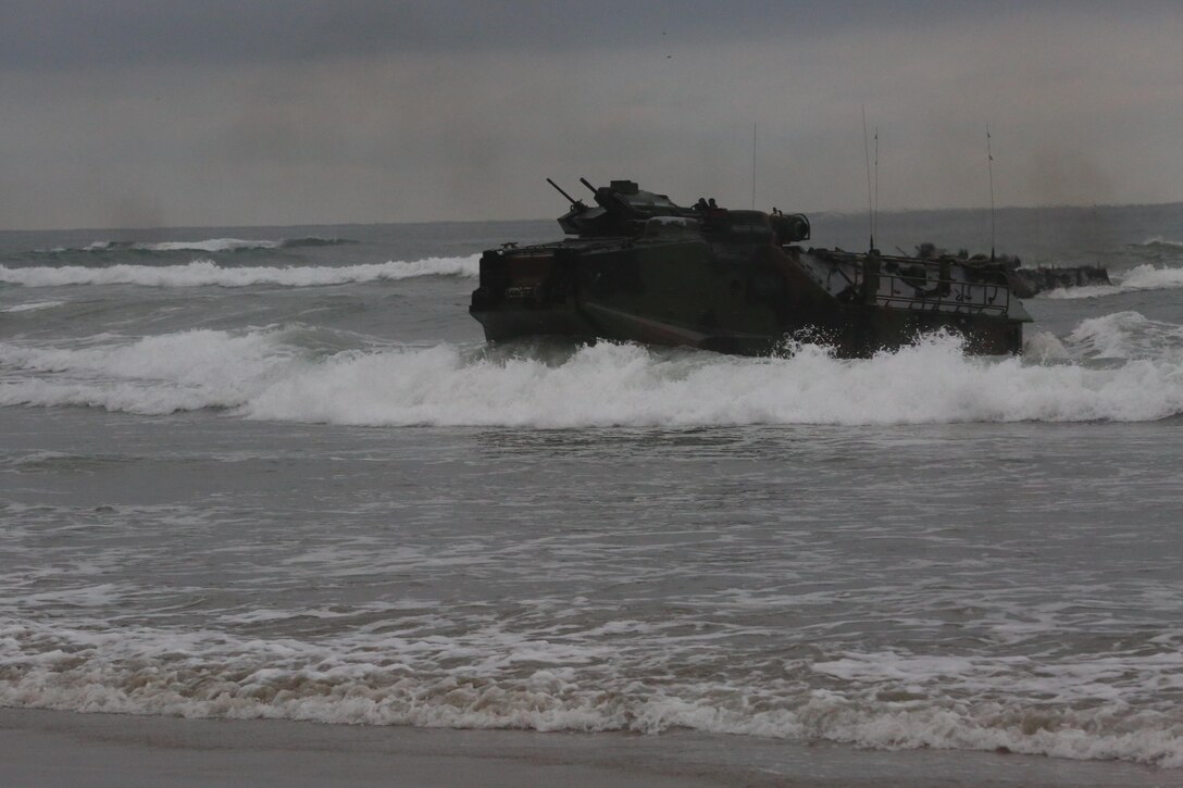 Marines with 3rd Battalion, 1st Marine Regiment approach the shore in an amphibious assault vehicle as part of a Marine Corps Combat Readiness Evaluation on Camp Pendleton, Calif., August 2, 2016. During a MCCRE, Marines perform various events to determine the combat readiness of the unit. (U.S. Marine Corps photo by Lance Cpl. Shellie Hall)