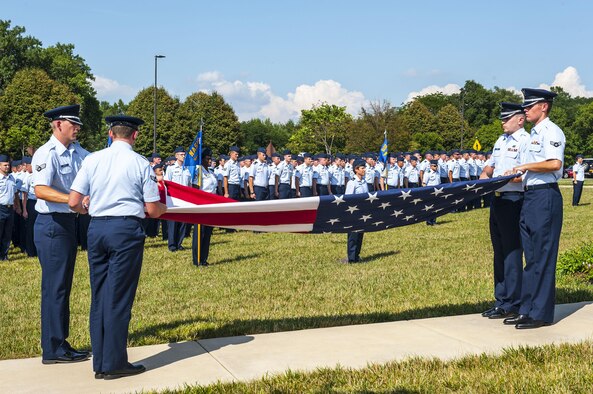 Airmen from the National Air and Space Intelligence Center participate in a retreat ceremony at Wright-Patterson Air Force Base, Ohio, Aug. 1, 2016. Retreat ceremonies serve a twofold purpose to signal the end of the official duty day and to pay respect to our nation's flag. Because the time for the end of the duty day varies, the commander designates the specific time for the retreat ceremony. (U.S. Air force photo/Tech. Sgt. Eunique P. Thomas)