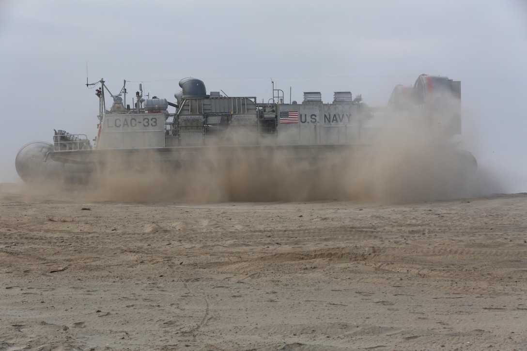 A U.S. Navy Landing Craft Air Cushion with Assault Craft Unit 5 lands during the amphibious assault training portion of a Marine Corps Combat Readiness Evaluation on Camp Pendleton, Calif., August 2, 2016. During a MCCRE, Marines perform various events to determine the combat readiness of the unit. The LCAC carries cargo, vehicles including high mobility multi-purpose wheeled vehicles and M1A1 Abrams tanks, and personnel for ship to shore movements.  (U.S. Marine Corps photo by Lance Cpl. Shellie Hall)