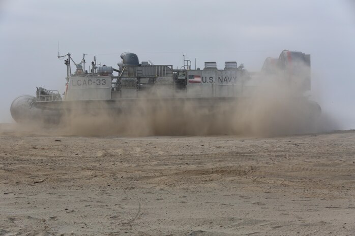 A U.S. Navy Landing Craft Air Cushion with Assault Craft Unit 5 lands during the amphibious assault training portion of a Marine Corps Combat Readiness Evaluation on Camp Pendleton, Calif., August 2, 2016. During a MCCRE, Marines perform various events to determine the combat readiness of the unit. The LCAC carries cargo, vehicles including high mobility multi-purpose wheeled vehicles and M1A1 Abrams tanks, and personnel for ship to shore movements.  (U.S. Marine Corps photo by Lance Cpl. Shellie Hall)