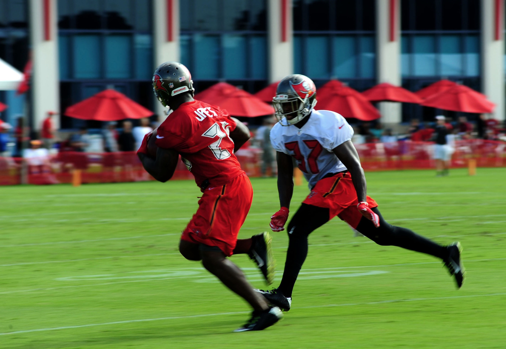 Keith Tandy, right, a safety with the Tampa Bay Buccaneers, tries to prevent Mike James, left, a wide receiver with the Tampa Bay Buccaneers from scoring as part of a drill during a training camp at Raymond James Stadium in Tampa, Fla, July 29, 2016. As the second line of defense the safety’s job is to stop any player that makes it past the defensive line and linebackers. (U.S Air Force photo by Airman 1st Class Rito Smith) 