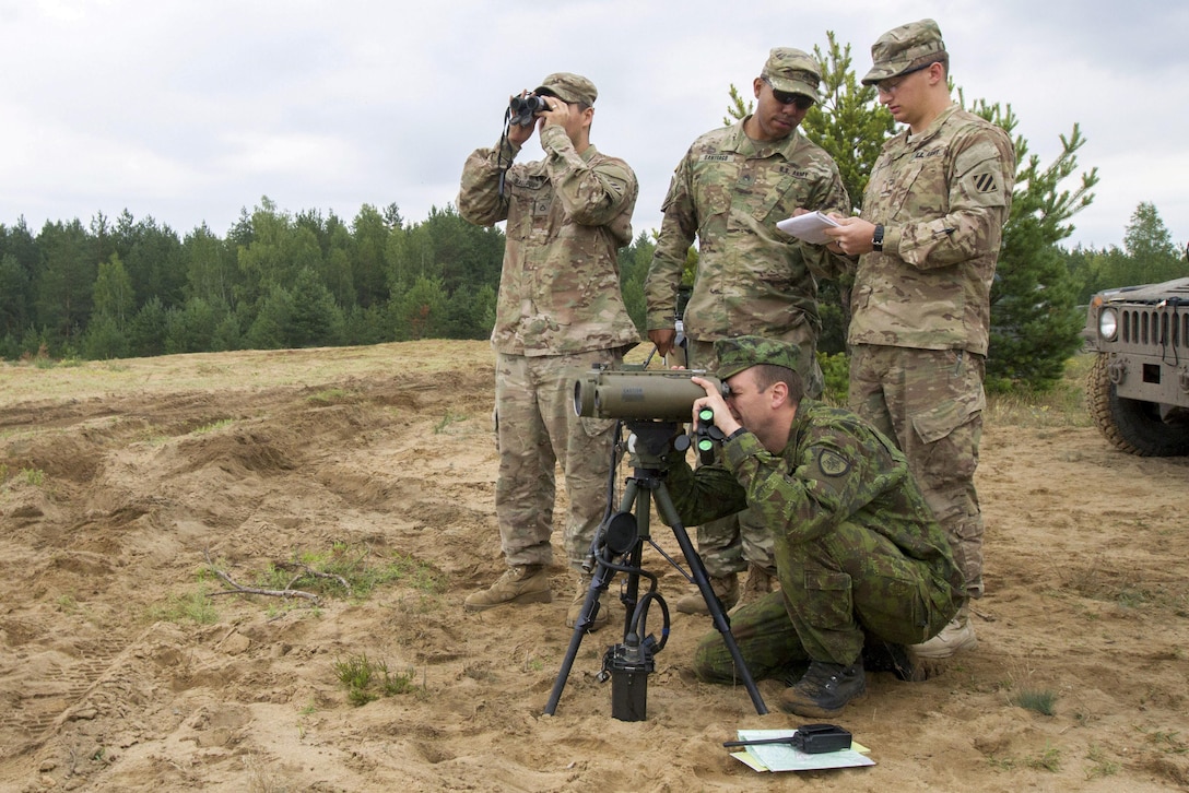 Soldiers plot grid coordinates for targets during Exercise Flaming Thunder in Pabrade, Lithuania, Aug. 4, 2016. Flaming Thunder is a two-week exercise that aims to enhance interoperability among NATO fire-support units. Army photo by Pfc. James Dutkavich