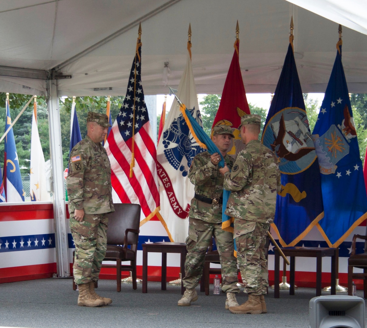 DLA Distribution commander, Army Brig. Gen. John S. Laskodi passes the flag to the new DLA Distribution Susquehanna commander, Army Col. Brad J. Eungard in the change of command ceremony on Aug. 5.