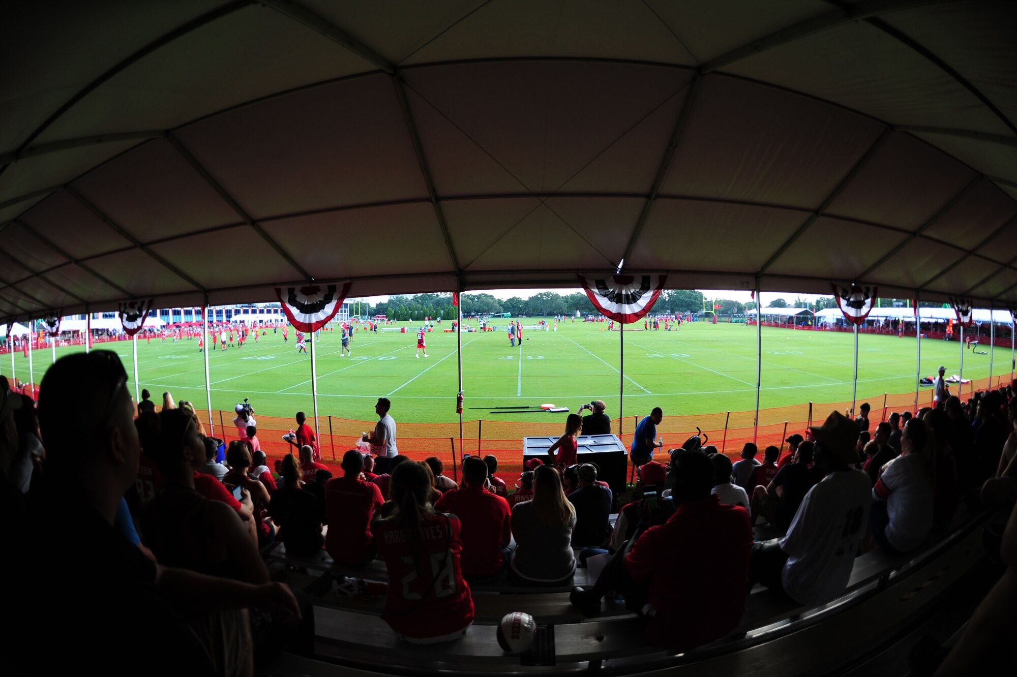Members of Team MacDill watch the Tampa Bay Buccaneers during a training camp at Raymond James Stadium July 29, 2016 in Tampa, Fla. This day was specifically set aside as a military day for service members and their families to come and see the Buccaneers practice. (U.S Air Force photo by Airman 1st Class Rito Smith.)