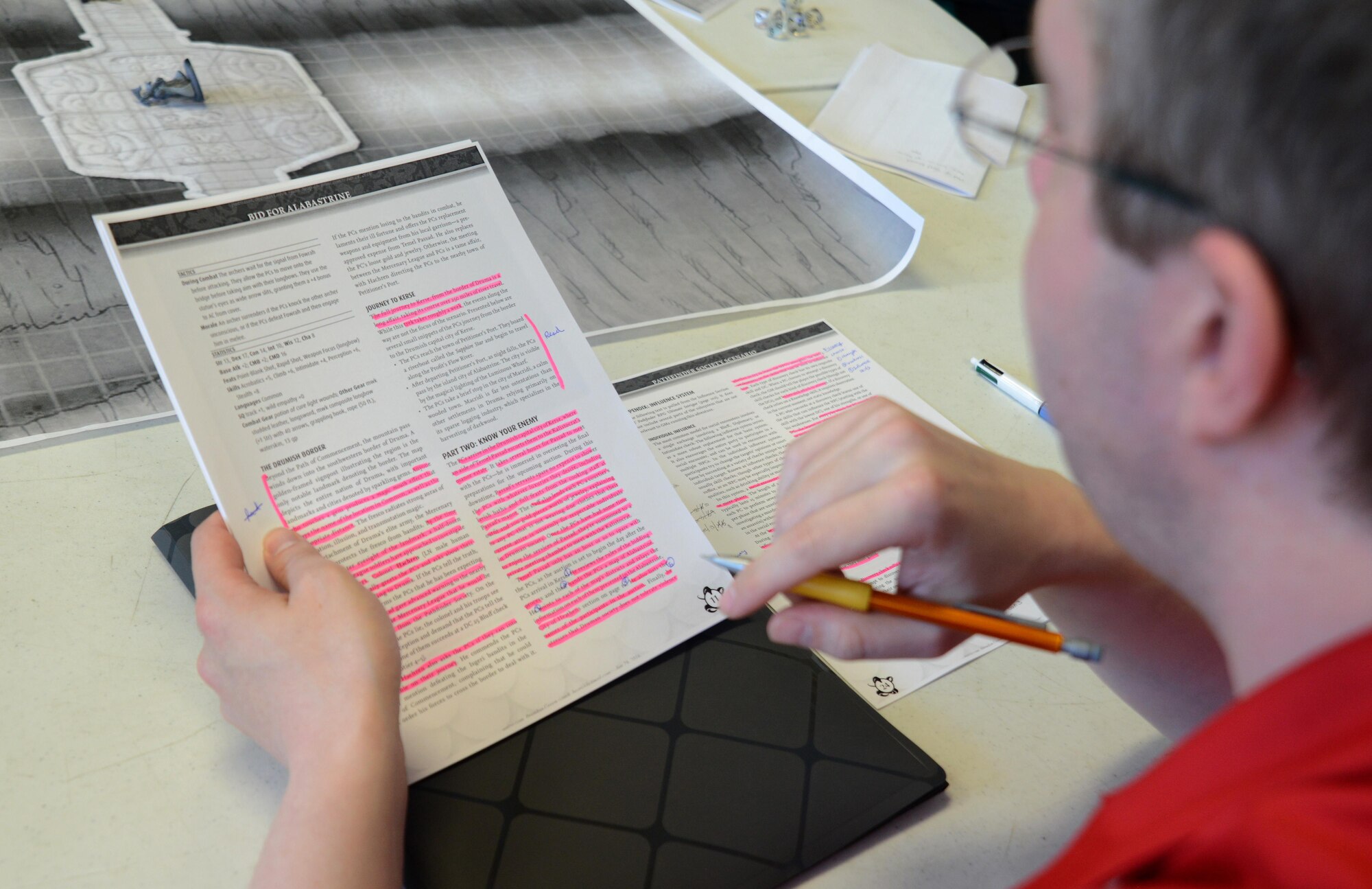 Brendon Green, Pathfinder Society Organized Play venture captain of Alaska, hosts a campaign at the Spenard Road Bosco’s comic book store, Anchorage, Alaska, July 23, 2016. Green flew from Fairbanks, Alaska to host a scenario as a game master. Pathfinder has roots in the traditional ‘pen-and-paper’ style of gameplay where game master describes the surroundings and outcomes of the players’ actions. 
