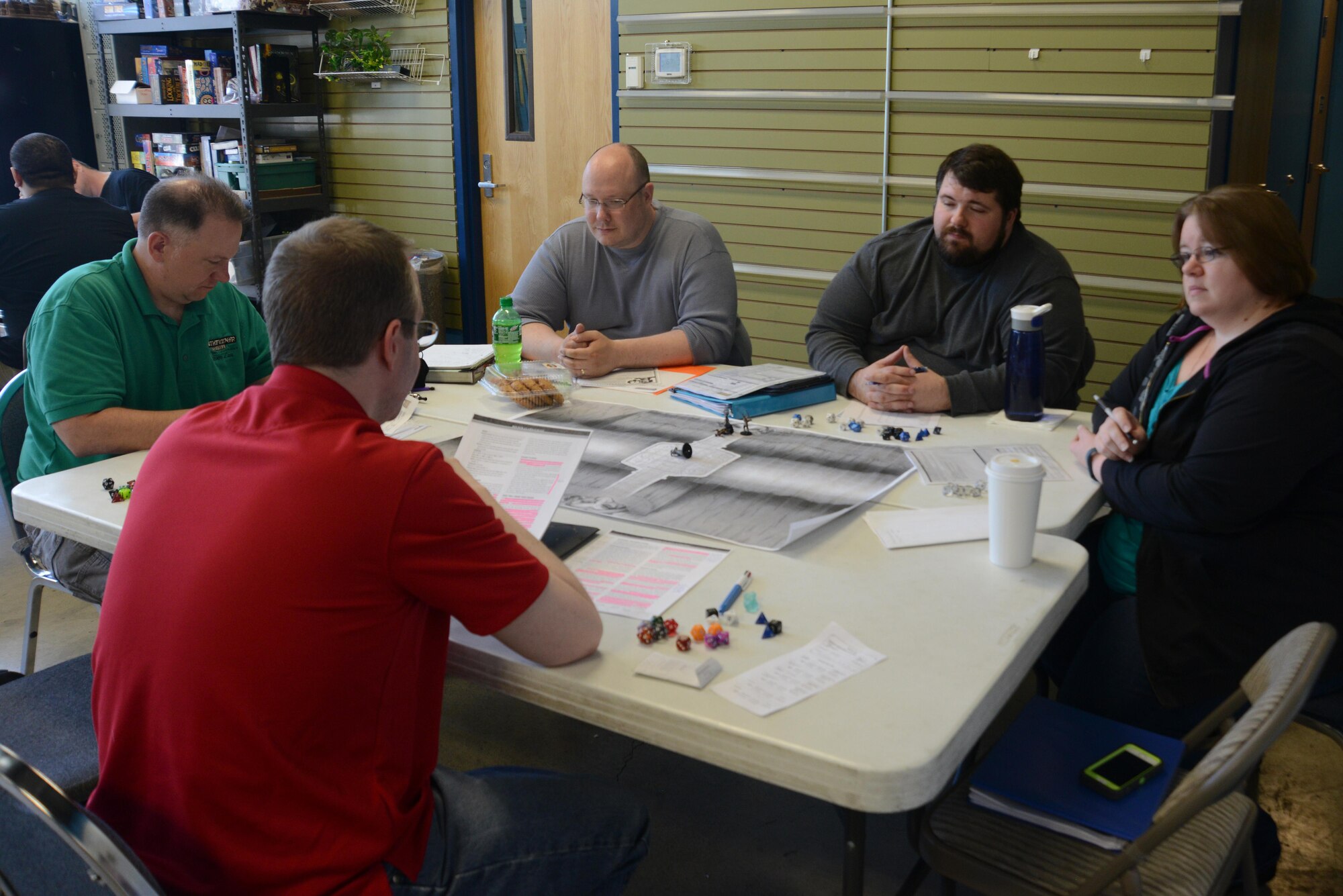 Players participate in a Pathfinder campaign at the Spenard Road Bosco’s comic book store, Anchorage, Alaska, July 23, 2016. The minimum requirement to fill a table is four players and one game master, with a limit of six total, but there can be second tables. 