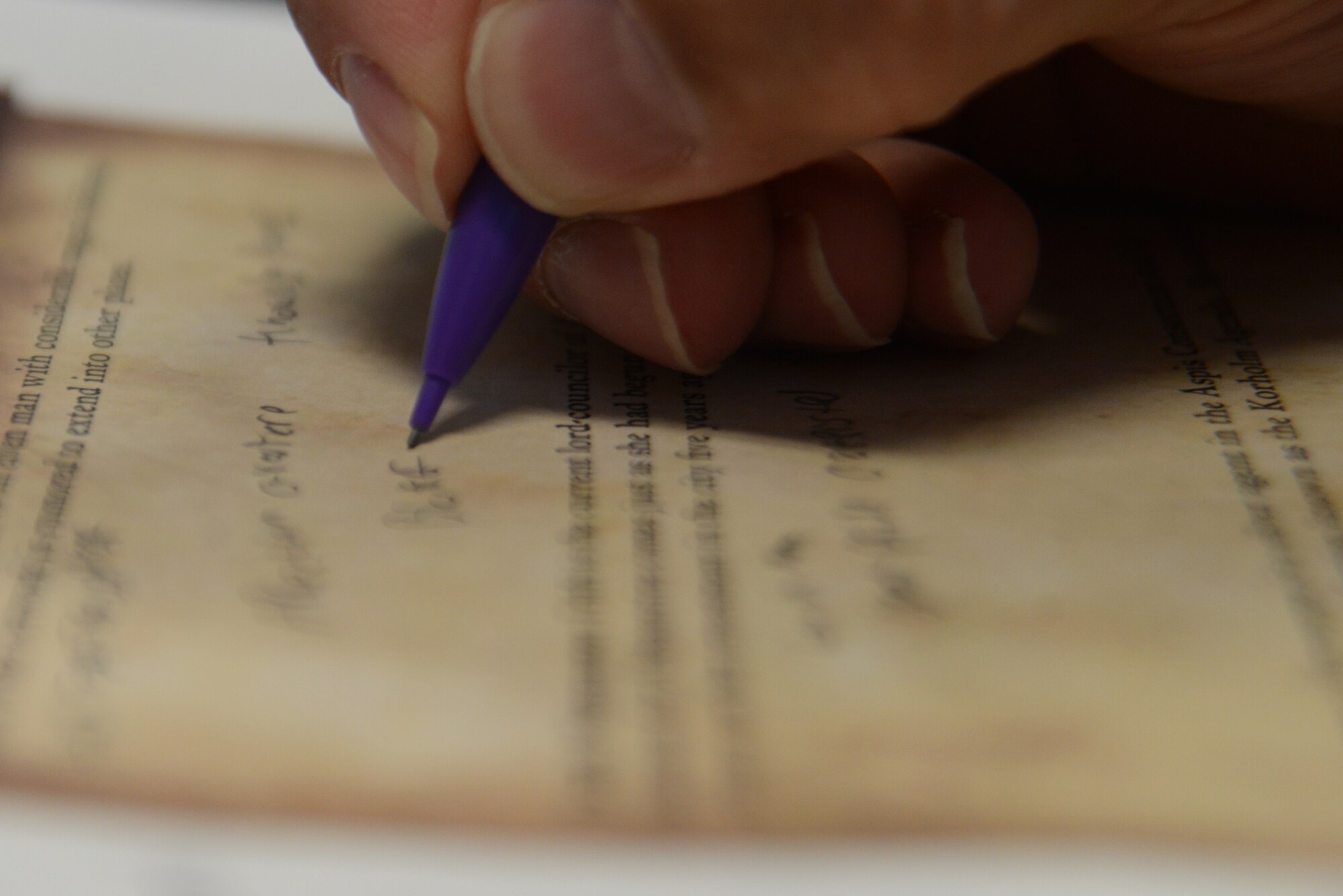 A player takes notes during a Pathfinder campaign at the Spenard Road Bosco’s comic book store, Anchorage, Alaska, July 23, 2016. Pathfinder has roots in the traditional ‘pen-and-paper’ style of gameplay where a game master describes the surroundings and outcomes of the players’ actions.