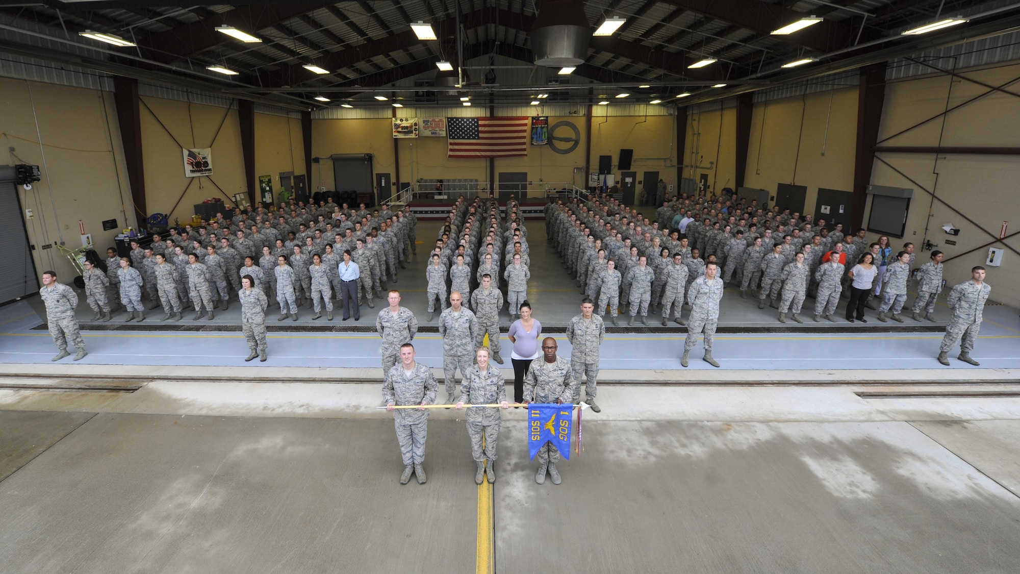 The 11th Special Operations Intelligence Squadron gathers for their first group photo as the 11th SOIS following a re-designation ceremony at Hurlburt Field, Fla., Aug. 1, 2016. The 11th SOIS re-named its squadron in an effort to standardize its organizational nomenclature with other squadrons in the 1st Special Operations Wing. (U.S. Air Force photo by Airman Dennis Spain)