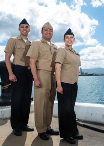 160729-N-LY160-052 JOINT BASE PEARL HARBOR-HICKAM (July 29, 2016) - Intelligence Specialist 1st Class John Pacheco, left, Lt. John Pacheco, middle, and Intelligence Specialist 1st Class Christine Smith pose for a photo at Commander, Submarine Force U.S. Pacific Fleet in Joint Base Pearl Harbor-Hickam. Twenty-six nations, 49 ships, six submarines, about 200 aircraft, and 25,00 personnel are participating in RIMPAC from June 29 to Aug. 4 in and around the Hawaiian Islands and Southern California. The world's largest international maritime exercise, RIMPAC provides a unique training opportunity while fostering and sustaining cooperative relationships between participants critical to ensuring the safety of sea lanes and security on the world's oceans. RIMPAC 2016 is the 25th exercise in the series that began in 1971. (U.S. Navy photo by Mass Communication Specialist 2nd Class Michael H. Lee)