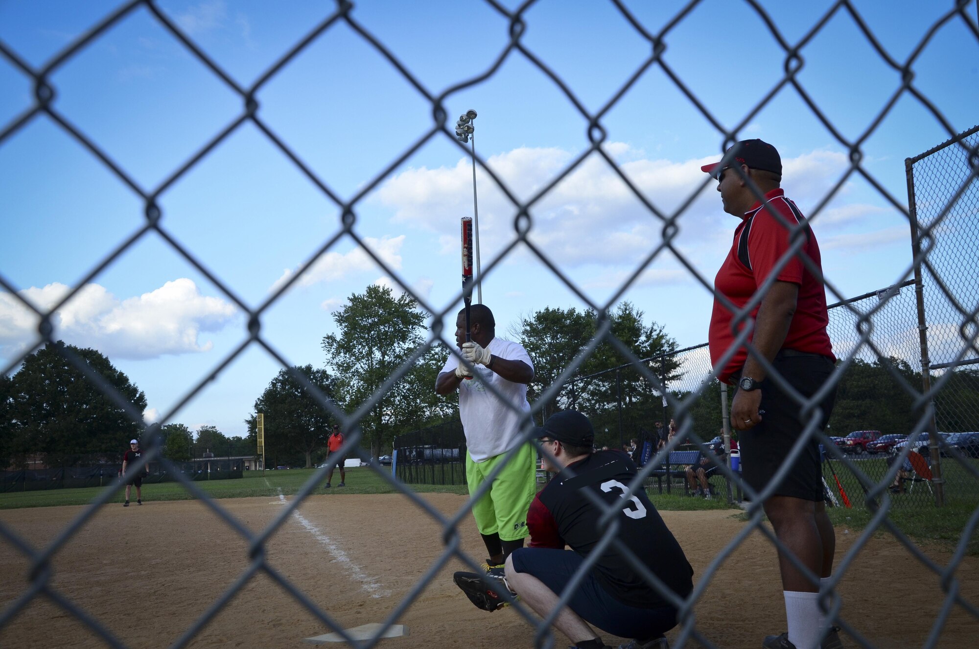 A Navy Information Operations Command player delivers a pitch during the Game 1 Division ONE Intramural Softball Championship game against the 34th Intelligence Squadron, August 3, 2016 at Fort Meade, Md. NIOC won the first game 19 to 9 to force a Game 2 against the 34th IS. (U.S. Air Force photo/Staff Sgt. AJ Hyatt)