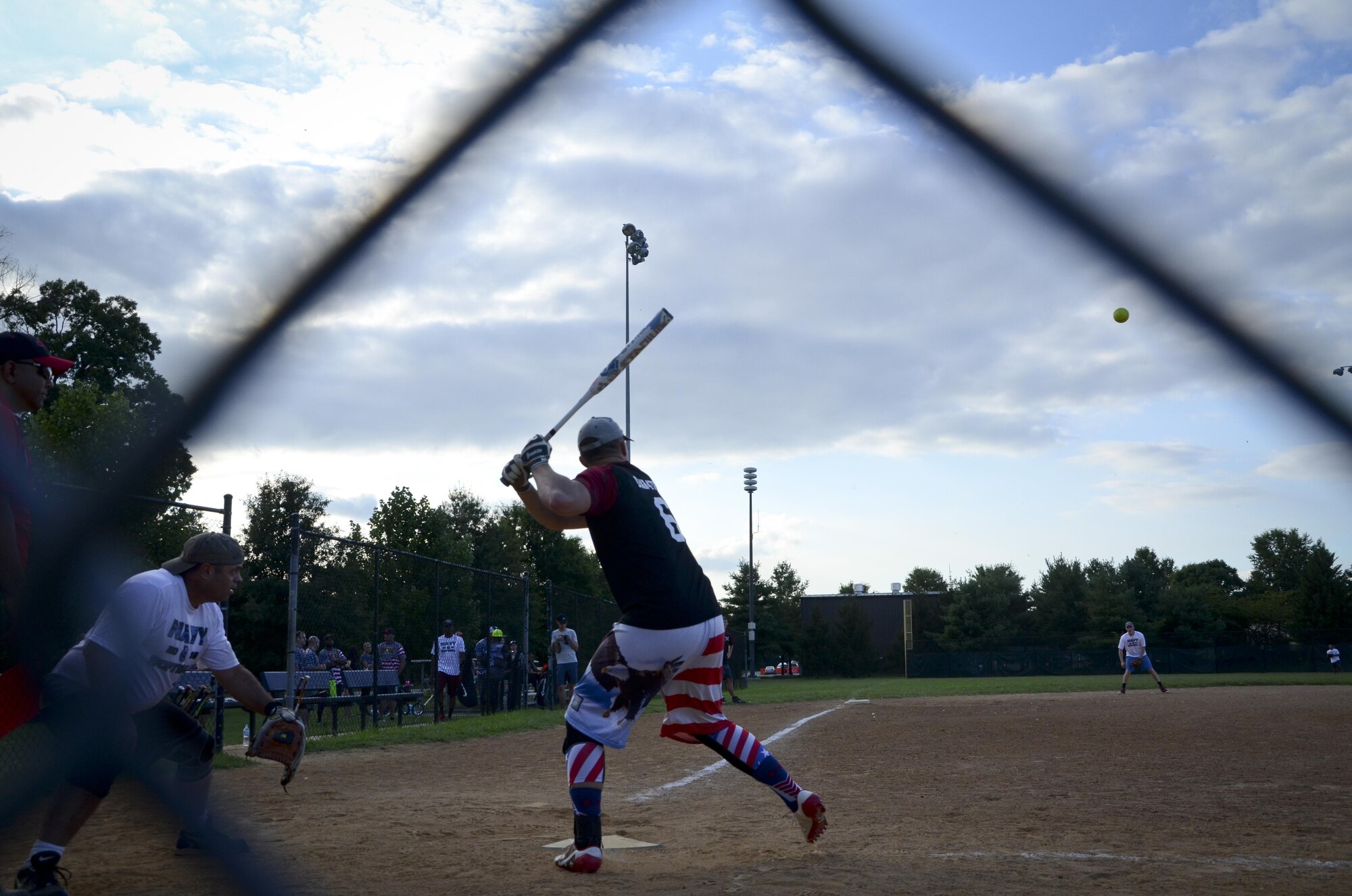 A 34th Intelligence Squadron player prepares to swing at a pitch during the Game 1 Division ONE Intramural Softball Championship game against the Navy Information Operations Command, August 3, 2016 at Fort Meade, Md. NIOC won the first game 19 to 9 to force a Game 2 against the 34th IS. (U.S. Air Force photo/Staff Sgt. AJ Hyatt)