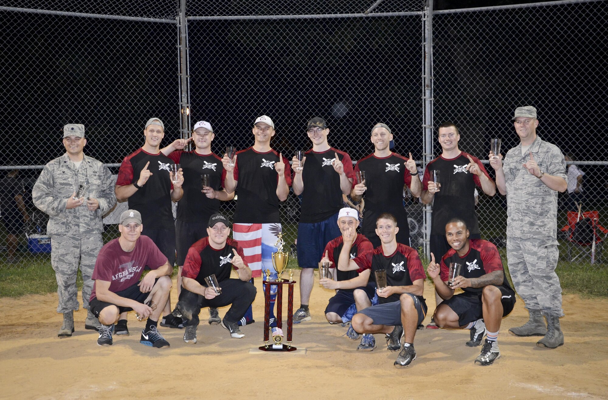 The 34th Intelligence Squadron (Ducks) pose for a group photo after beating the Navy Information Operations Command softball team 31 to 25 for the Division ONE Fort Meade Intramural Softball Championship, August 3, 2016 at Fort Meade, Md. In this double-elimination tournament, the 34th IS came into the Championship game with zero losses, while NIOC had one loss. NIOC was able to force a Game 2 by defeating the 34th IS by a score of 19 to 9 earlier in the night. (U.S. Air Force photo/Staff Sgt. AJ Hyatt)