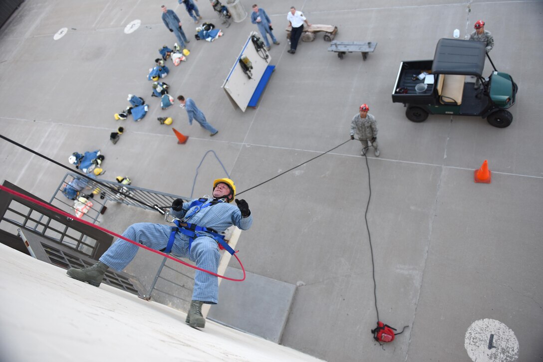 U.S. Air Force Lt. Col. Garrett Stumb, 315th Civil Engineer Squadron Commander, Joint Base Charleston, rappels down a 3-story building during a Fire Marshall course at the Louis F. Garland Department of Defense Fire Academy on Goodfellow Air Force Base, Texas, Aug. 3, 2016. Goodfellow provided the course to allow civil engineer squadron commanders, and representatives of the same capacity, gain their Fire Marshal certification. (U.S. Air Force photo by Airman 1st Class Caelynn Ferguson/Released)