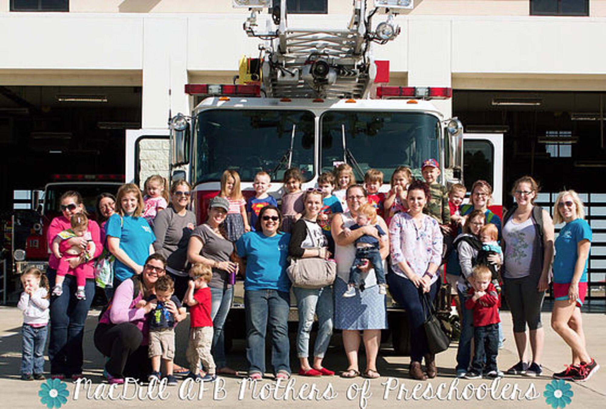 The MacDill Mothers of Preschoolers pause for a group photo during a tour of the fire station last year at MacDill Air Force Base, Fla.  Currently, there are approximately 50 to 60 mothers on the roster, but it continuously changes because of frequent moves of military members. (Courtesy Photo)