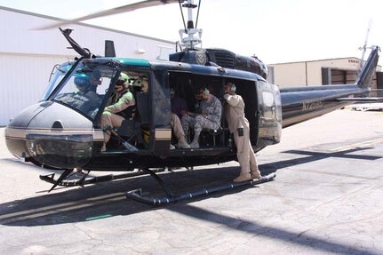 Air Force Gen. Lori J. Robinson (center), commander of NORAD and U.S. Northern Command, receives an aerial tour of the greater El Paso, Texas, regional area, July 20, 2016. The El Paso Air Branch provided the general with a tour of the international border, downtown El Paso, Fort Hancock, Texas, and Santa Teresa, N.M.
