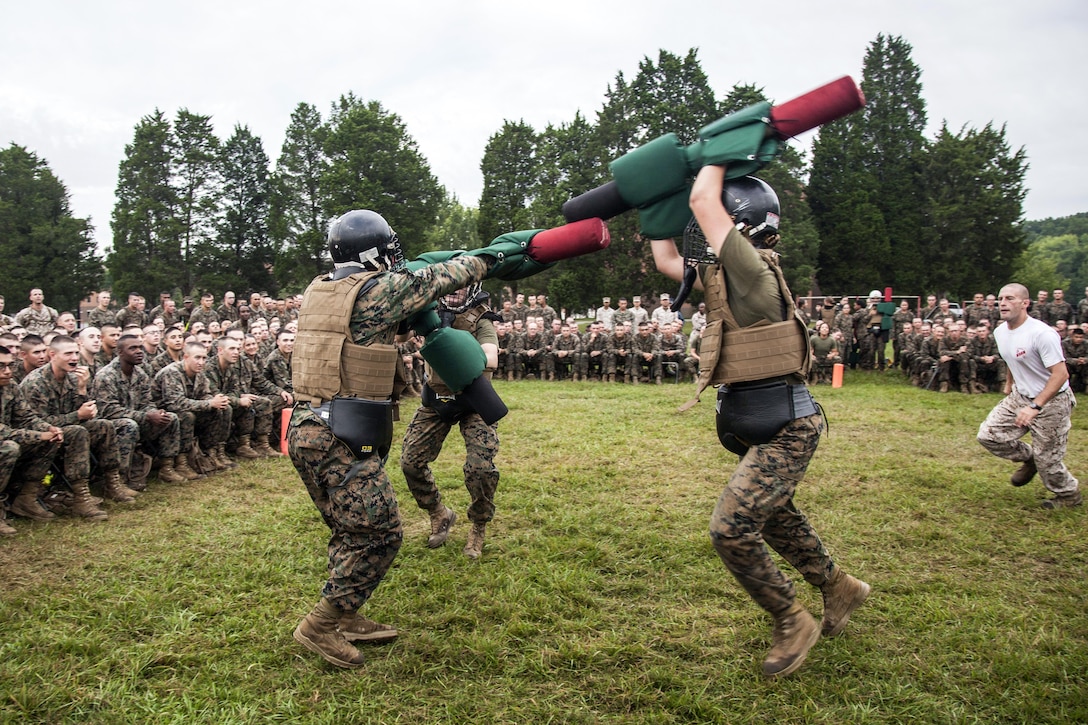 Marines in Officer Candidates School compete against each other using pugil sticks at Marine Corps Base Quantico, Va., July 30, 2016. The school's mission is to educate and train Marine Corps officer candidates. Marine Corps photo by Lance Cpl. Jose Villalobosrocha