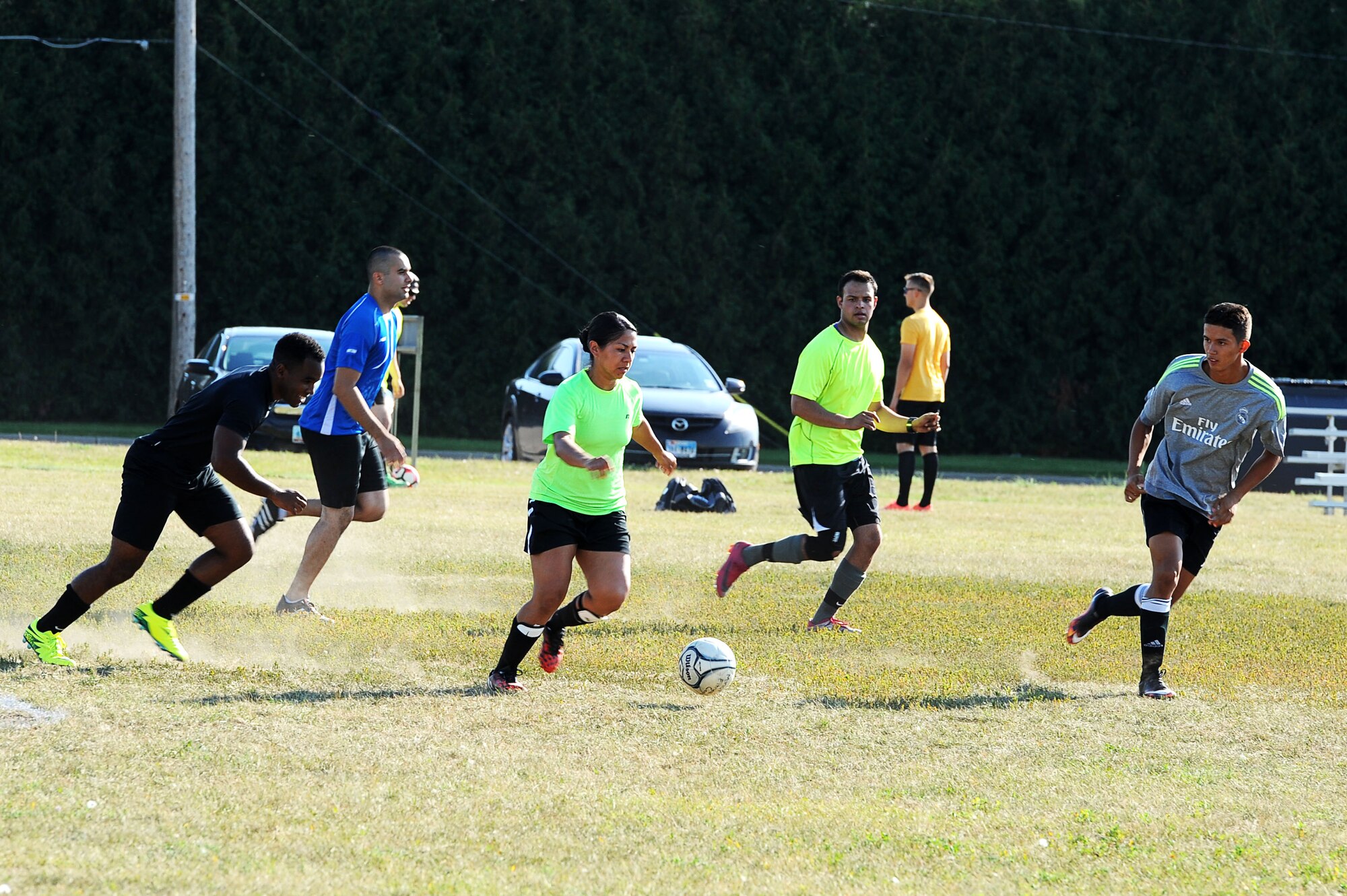 An Airman from the 5th Security Forces Squadron prepares to kick a soccer ball during the intramural soccer league at Minot Air Force Base, N.D., Aug. 1, 2016. The league kicked off with the 5th SFS facing the 91st MSFS for a chance at winning the Commander’s Cup trophy. (U.S. Air Force photo/Senior Airman Kristoffer Kaubisch)
