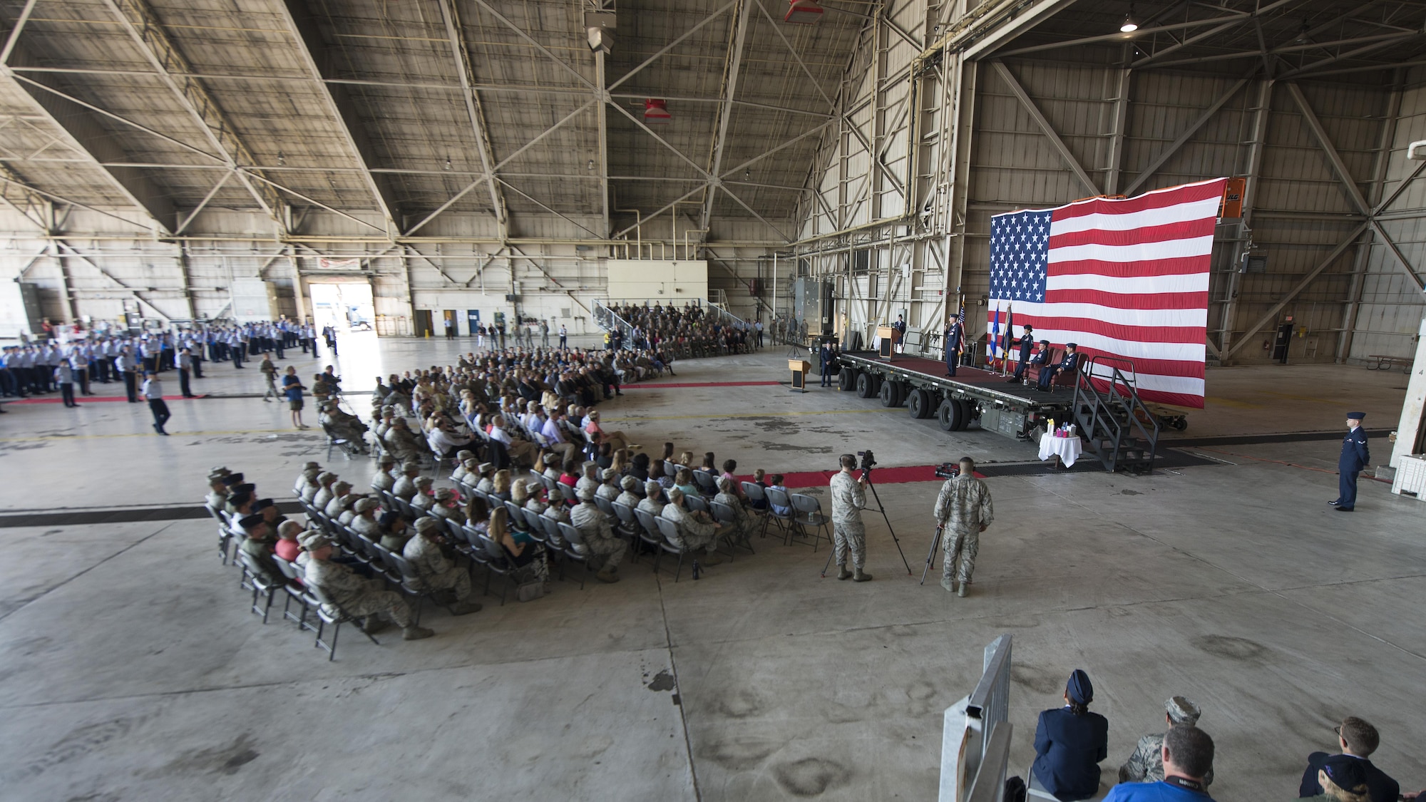 The 436th Airlift Wing held a Change of Command ceremony Aug. 5, 2016, inside Hangar 706, on Dover Air Force Base, Del. Col. Michael Grismer relinquished command to Col. Ethan Griffin in a ceremony officiated by Brig. Gen. Patrick Mordente, 18th Air Force vice commander. (U.S. Air Force photo/Senior Airman Zachary Cacicia)