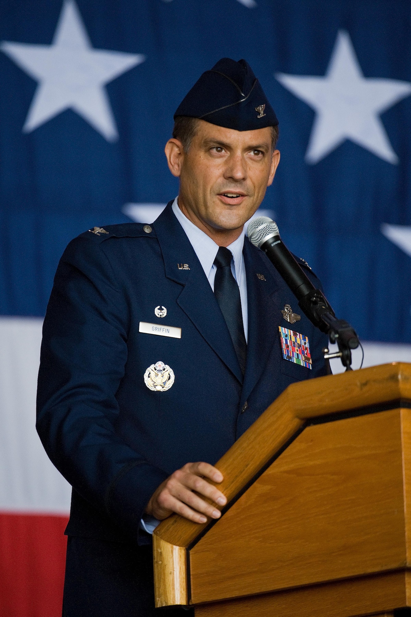 Col. Ethan Griffin, right, accepts the wing colors from Brig. Gen. Patrick Mordente, 18th Air Force vice commander, left, Aug. 5, 2016, inside Hangar 706, on Dover Air Force Base, Del. Griffin assumed command of the 436th Airlift Wing during a change of command ceremony and became 436th AW’s 33rd commander. (U.S. Air Force photo/Roland Balik)