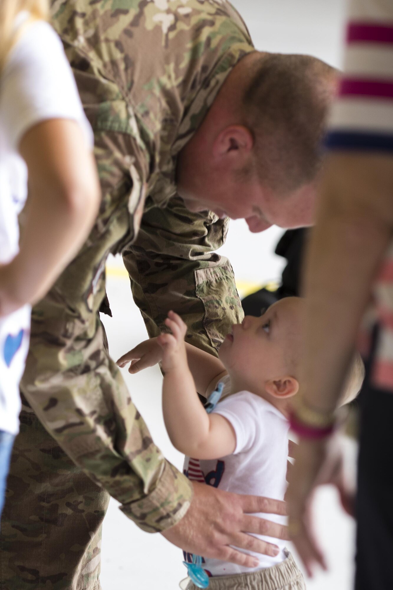 U.S. Air Force Staff Sgt. Michael Bortle, 23d Equipment Maintenance Squadron aerospace ground equipment craftsman, greets his son, William, after returning from a deployment, Aug. 5, 2016, at Moody Air Force Base, Ga. While deployed, AGE Airmen performed maintenance by diagnosing mechanical and electronic malfunctions, as well as inspecting and approving completed maintenance actions. (U.S. Air Force photo by Airman Daniel Snider) 