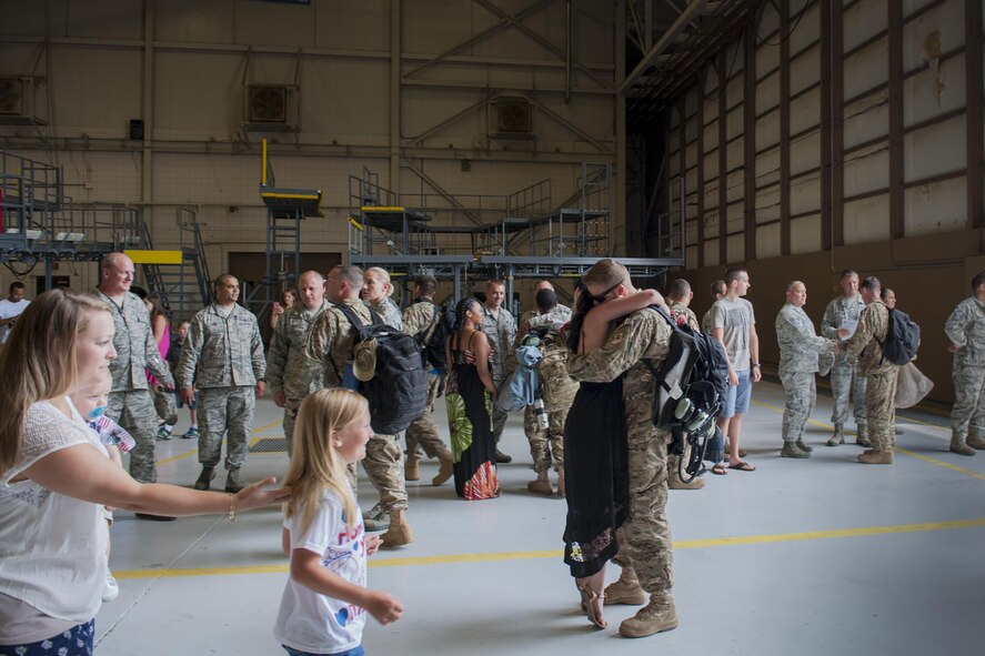 U.S. Air Force Staff Sgt. Michael Bortle, 23d Equipment Maintenance Squadron aerospace ground equipment craftsman, greets his son, William, after returning from a deployment, Aug. 5, 2016, at Moody Air Force Base, Ga. While deployed, AGE Airmen performed maintenance by diagnosing mechanical and electronic malfunctions, as well as inspecting and approving completed maintenance actions. (U.S. Air Force photo by Airman Daniel Snider) 