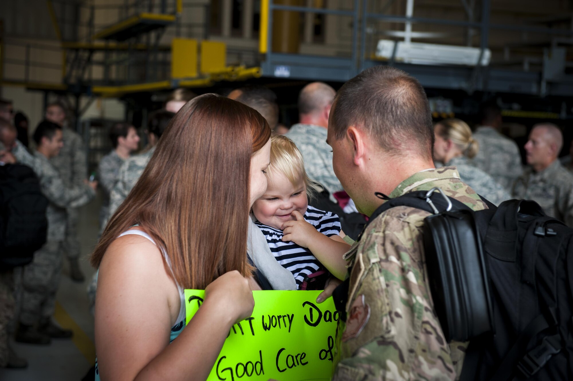 Emma Gross smiles as she greets her father, U.S. Air Force Staff Sgt. Michael Gross, 71st Aircraft Maintenance Unit dedicated crew chief, after returning from a deployment, Aug. 5, 2016, at Moody Air Force Base, Ga. Approximately 50 Airmen returned from a four-month deployment supporting operations in the horn of Africa. (U.S. Air Force photo by Airman Daniel Snider)