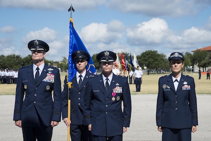 U.S. Air Force Lt. Gen. Darryl Roberson, commander of Air Education and Training Command; Brig. Gen. Bob LaBrutta, outgoing 502nd Air Base Wing and Joint Base San Antonio commander; and Brig. Gen. Heather Pringle, incoming commander, stand at attention during the 502nd Air Base Wing and Joint Base San Antonio change of command ceremony at JBSA-Fort Sam Houston's MacArthur Parade Field Aug. 5, 2016. The change of command ceremony represents the formal passing of responsibility, authority and accountability of command from one officer to another. 