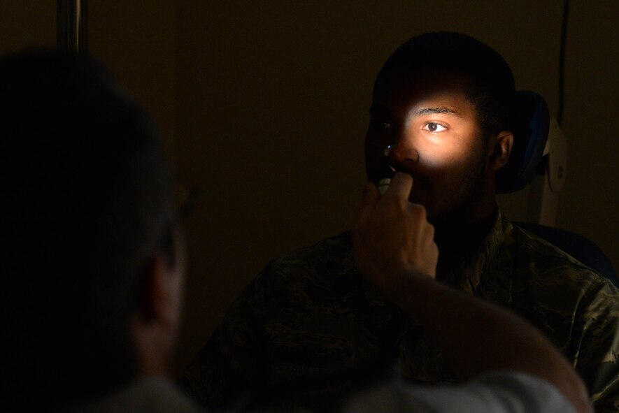 An Airman from the 705th Munitions Squadron receives a pre-flight physical at Minot Air Force Base, N.D., Aug. 5, 2016. Pre-flight physicals check for color blindness, depth perception and distance vision accuracy. (U.S. Air Force photo/Airman 1st Class Jessica Weissman)
