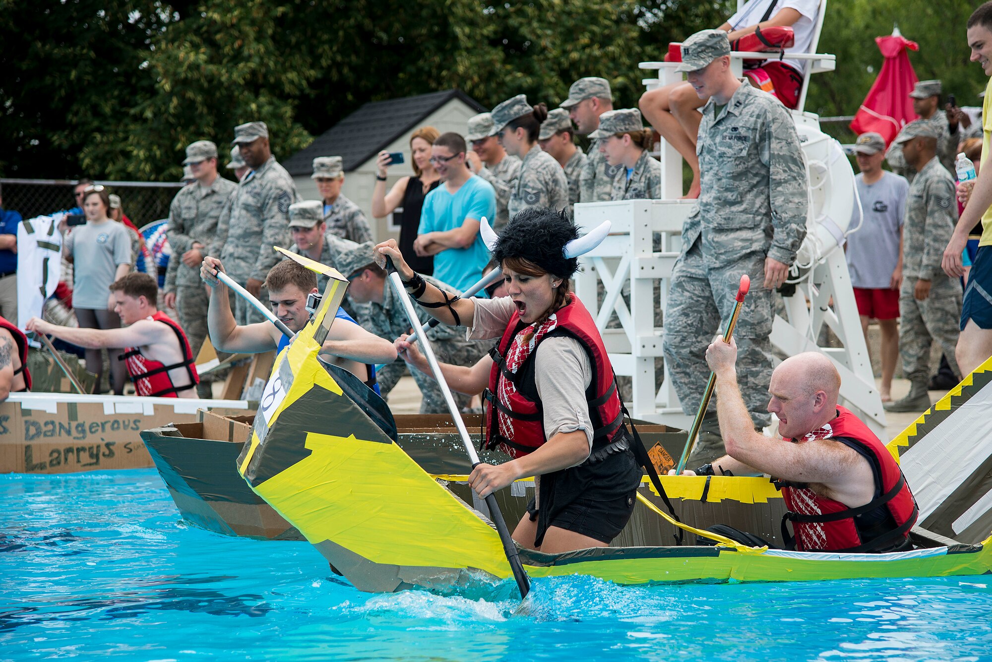 Senior Airman Megan Friedl and Staff Sgt. Clayton Lenhardt begin the second heat during the annual boat regatta at Scott Air Force Base, Ill., Aug. 5, 2016. Their boat ultimately sank before completing the race. Friedl and Lenhardt were members of the 375th Air Mobility Wing Public Affairs team. (U.S. Air Force photo by Tech. Sgt. Jonathan Fowler)