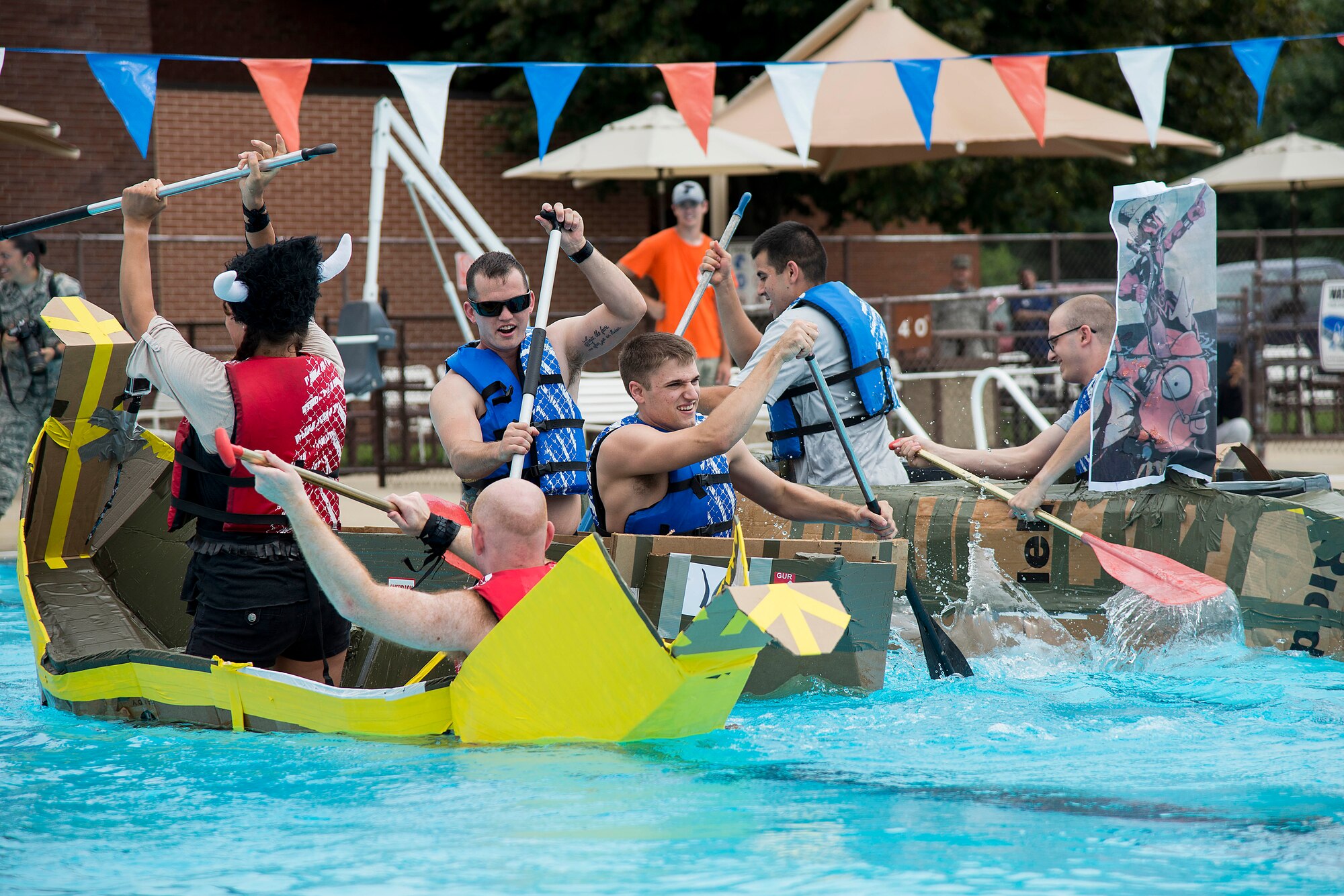 Multiple teams attempt to row past each other during the second heat of the annual boat regatta at Scott Air Force Base, Ill., Aug. 5, 2016. The 375th Logistics Readiness Squadron D flight team won the heat and placed first overall in the regatta. (U.S. Air Force photo by Tech. Sgt. Jonathan Fowler)