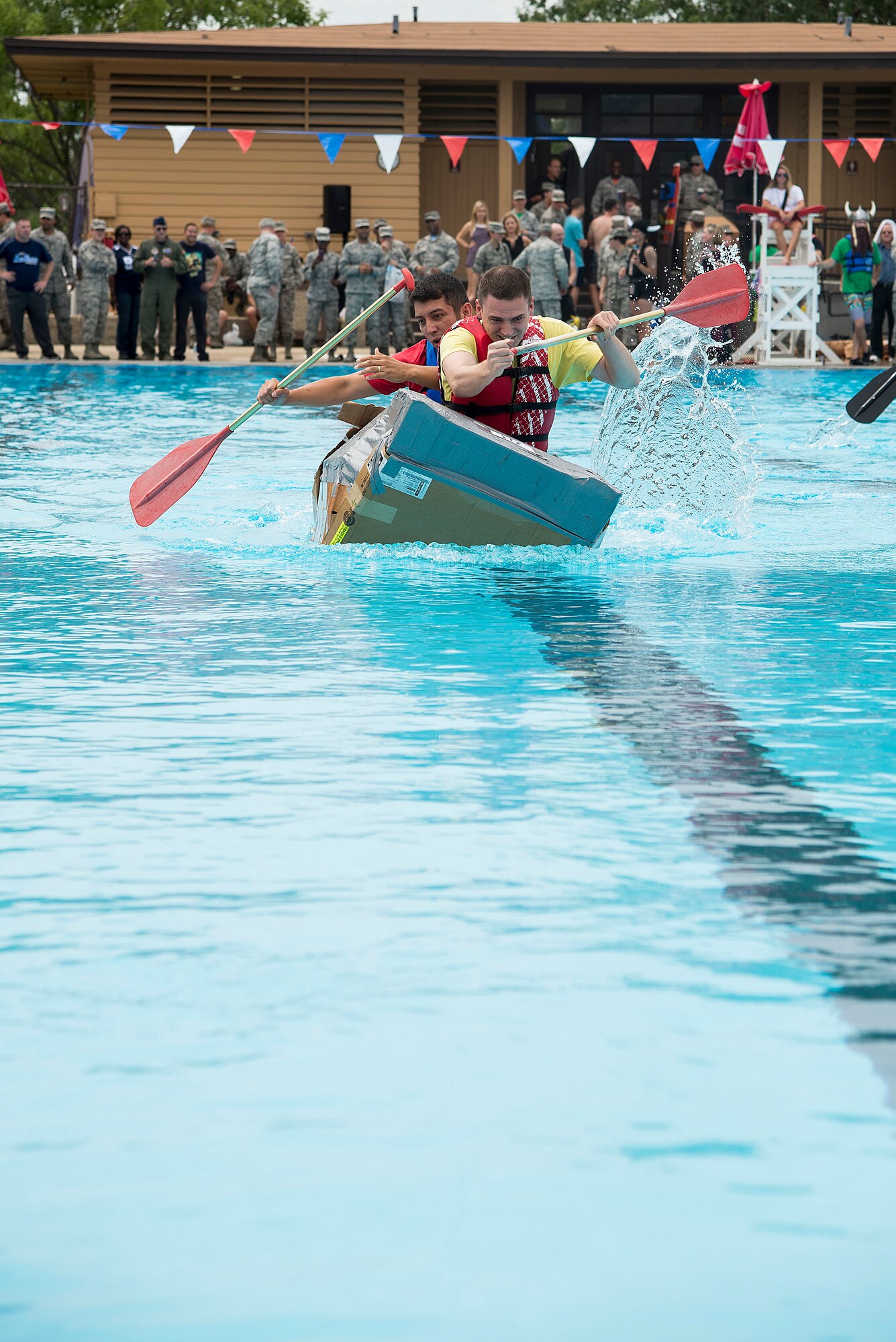 Members of the Cyber Space Support Squadron team compete in the third heat of the annual boat regatta at Scott Air Force Base, Ill., Aug. 5, 2016. Their team barely won their heat but came in second overall in the event. (U.S. Air Force photo by Tech. Sgt. Jonathan Fowler)