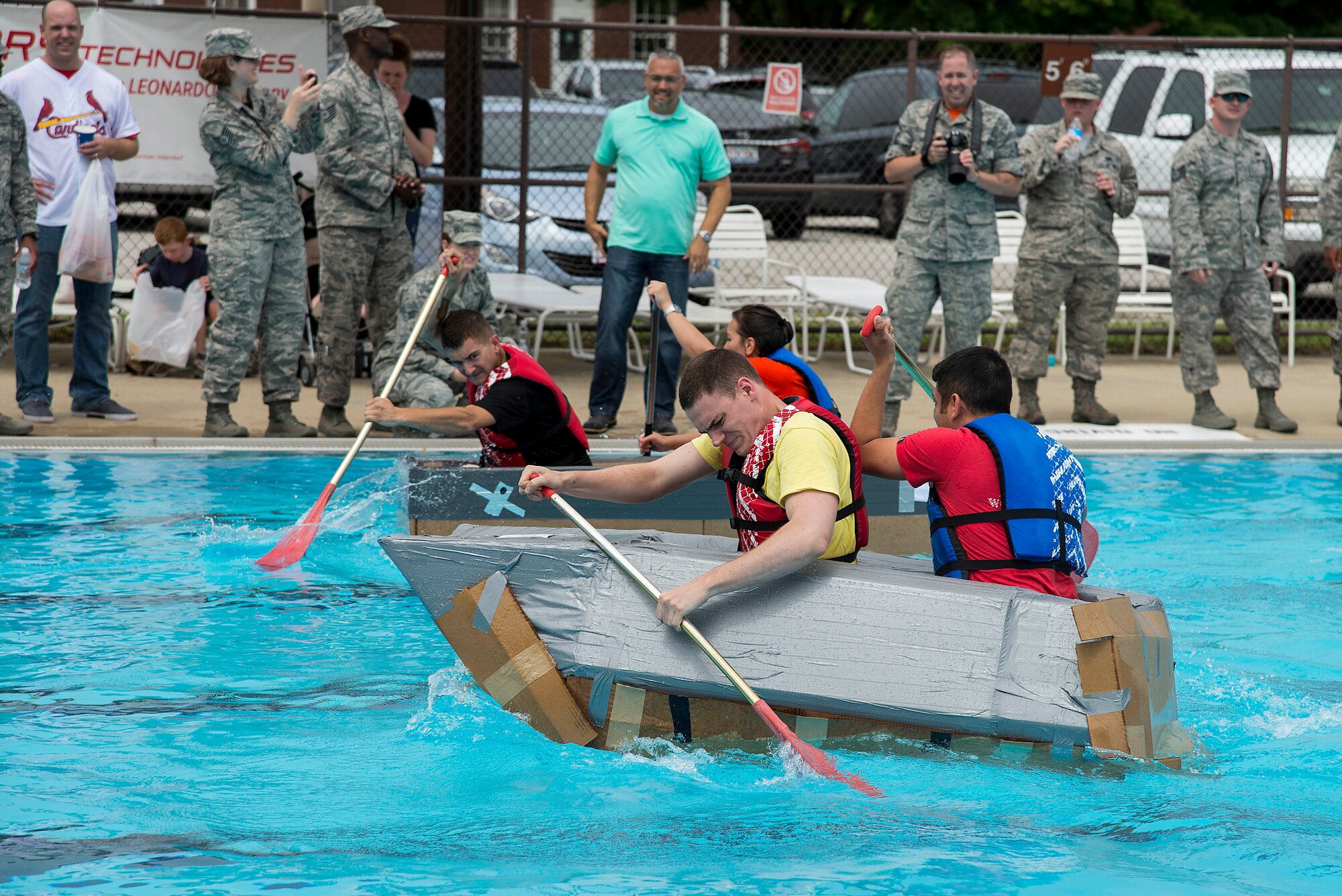 Members of the Cyber Space Support Squadron team compete in the third heat of the annual boat regatta at Scott Air Force Base, Ill., Aug. 5, 2016. Their team barely won their heat but came in second overall in the event. (U.S. Air Force photo by Tech. Sgt. Jonathan Fowler)
