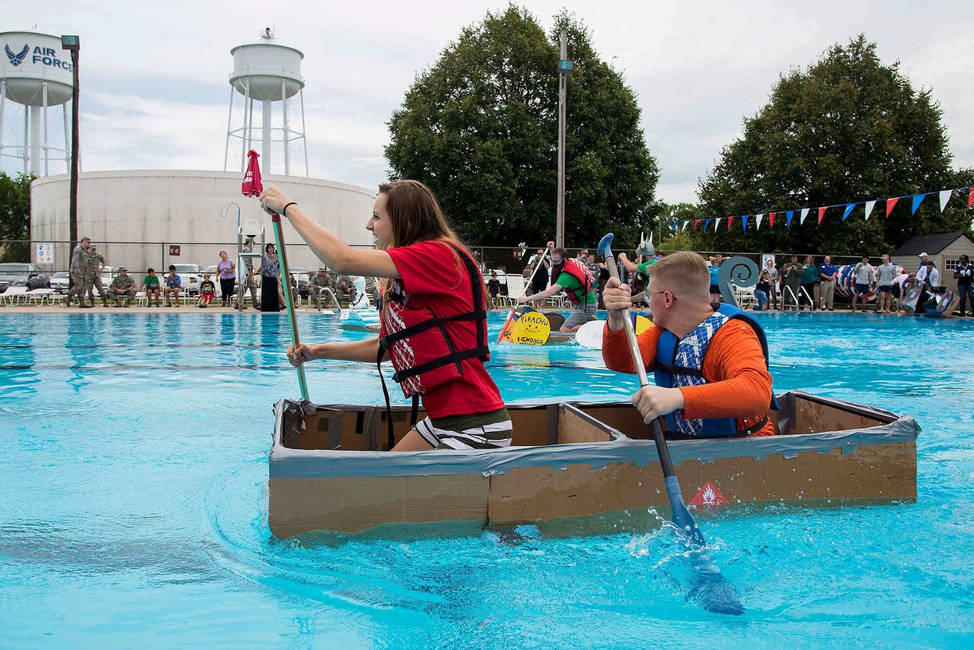 Members of the 375th Medical Operations Squadron team compete in the annual boat regatta at Scott Air Force Base, Ill., Aug. 5, 2016. The 375th MDOS team won the first heat but sank during the final race. (U.S. Air Force photo by Tech. Sgt. Jonathan Fowler)