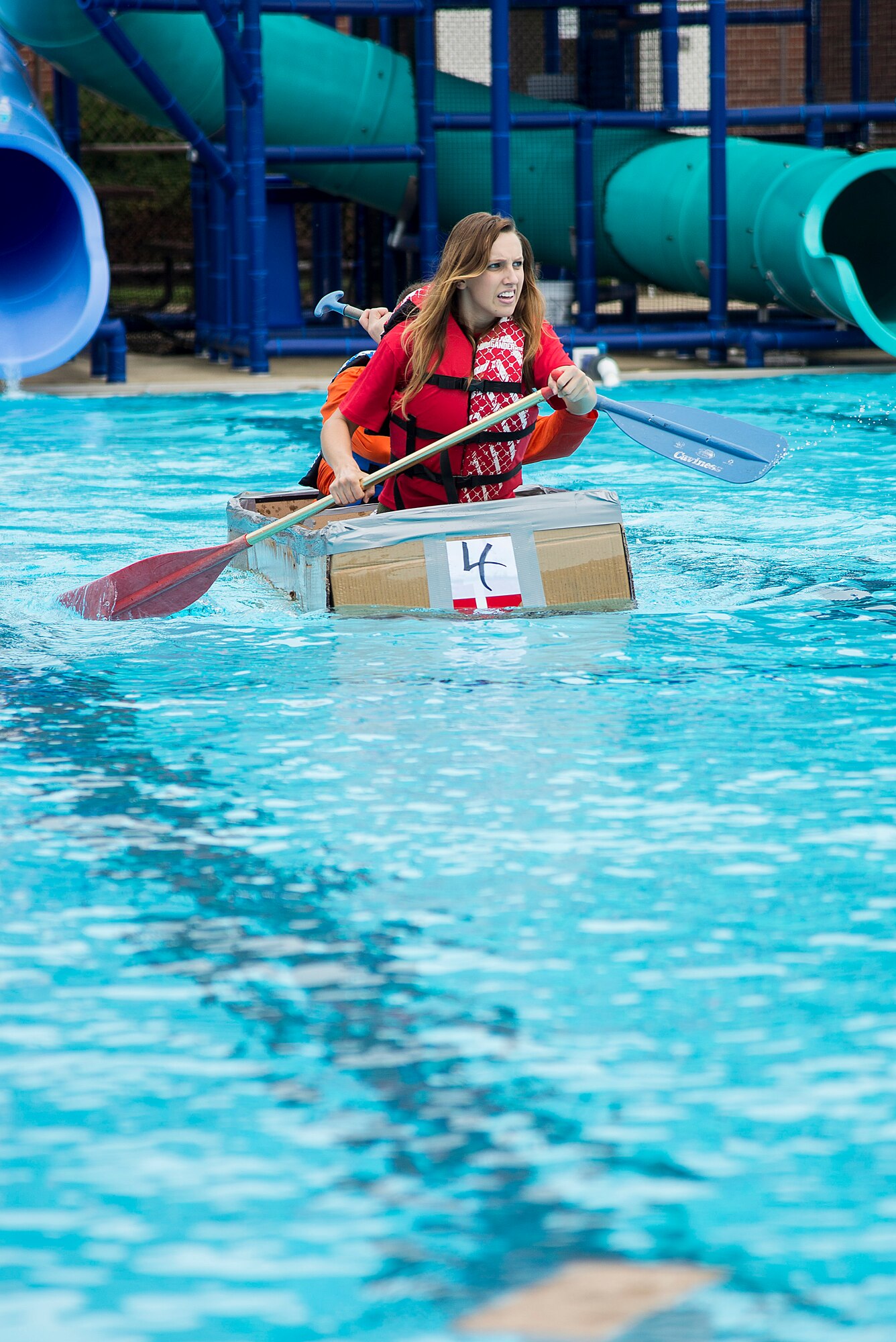 Members of the 375th Medical Operations Squadron team compete in the annual boat regatta at Scott Air Force Base, Ill., Aug. 5, 2016. The 375th MDOS team won the first heat but sank during the final race. (U.S. Air Force photo by Tech. Sgt. Jonathan Fowler)