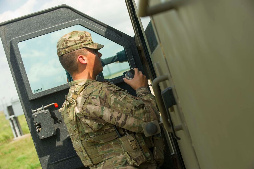 Airman 1st Class Jacob McWilliams, 91st Missile Security Forces Squadron fire team member, briefs missile alert facility personnel from a launch facility in the missile complex, N.D., Aug. 3, 2016. After completing security sweeps, defenders will report back to the MAF of what their findings were. (U.S. Air Force photo/Senior Airman Apryl Hall)