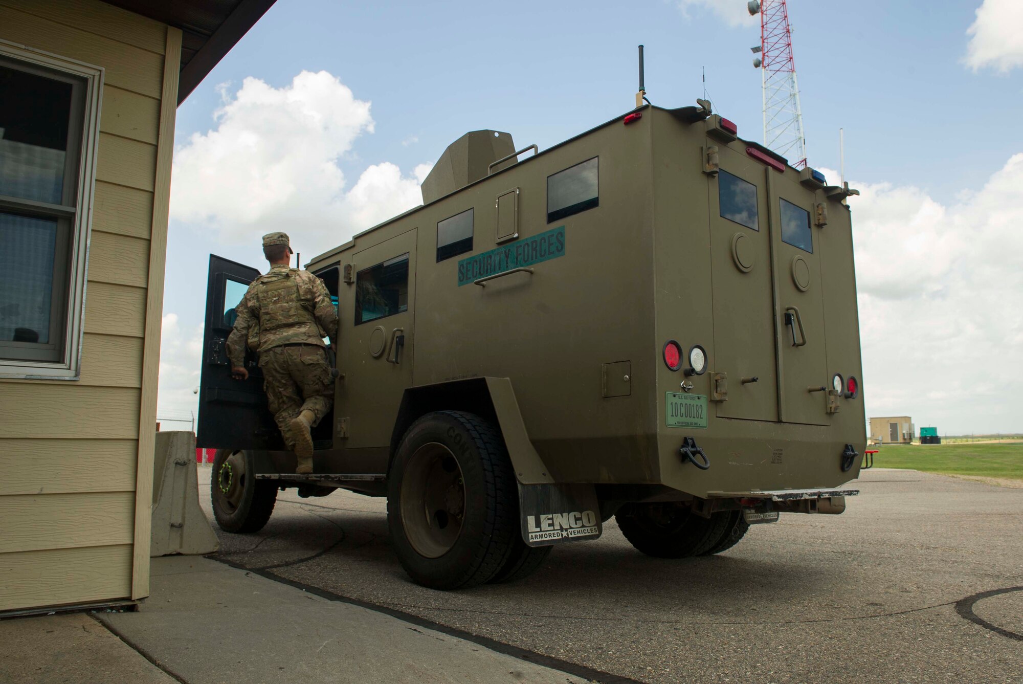 Airman 1st Class Jacob McWilliams, 91st Missile Security Forces Squadron fire team member, gets into a bearcat vehicle at C-01 missile alert facility, N.D., Aug. 3, 2016. Missile defenders’ area of responsibility covers over 8,500 square miles. (U.S. Air Force photo/Senior Airman Apryl Hall)