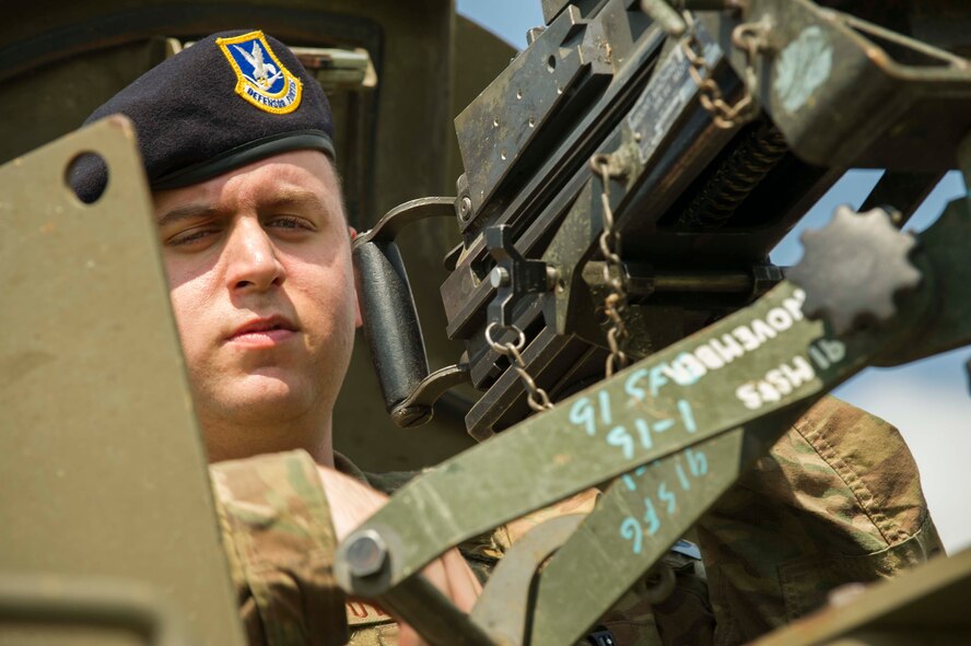 Airman 1st Class Robert O’brien, 91st Missile Security Forces Squadron fire team member, scans the land from the turret of a bearcat vehicle in the missile complex, N.D., Aug. 3, 2016. The team checks for suspicious activity on missile launch facilities throughout the missile field. (U.S. Air Force photo/Senior Airman Apryl Hall)