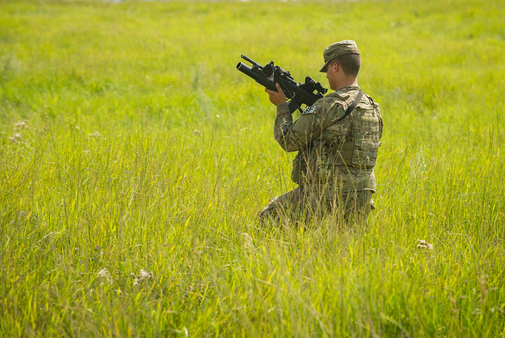 Airman 1st Class Jacob McWilliams, 91st Missile Security Forces Squadron fire team member, does a security sweep around a launch facility in the missile complex, N.D., Aug. 3, 2016. Missile wing defenders trip out to the missile field for four-day periods to provide security for the missile complex. (U.S. Air Force photo/Senior Airman Apryl Hall)