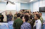 Cmdr. Dennis Spence, an anesthesiologist assigned to USNS Mercy (T-AH 19), conducts a tour of an operating room for heads of delegation from the Asia Pacific Military Health Exchange (APMHE) during a tour aboard Mercy. Mercy is in Malaysia for Pacific Partnership 2016, the first time the mission has visited Malaysia. Partner nations are working side-by-side with local organizations in a search and rescue exercise, civil engineering projects, community relation events and subject matter expert exchanges. 