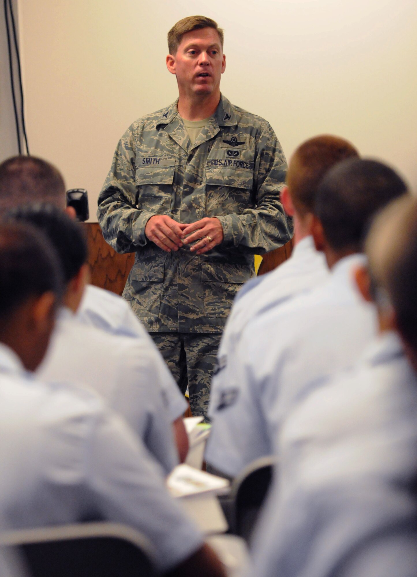 Col. C. Mike Smith, 81st Training Wing vice commander, welcomes non-prior service Airmen to Keesler during their in-processing at the Levitow Training Support Facility July 2, 2016, on Keesler Air Force Base, Miss. Base leadership welcomes the new Airmen every Tuesday upon their arrival from enlisted basic military training at Lackland Air Force Base, Texas. (U.S. Air Force photo by Kemberly Groue/Released) 