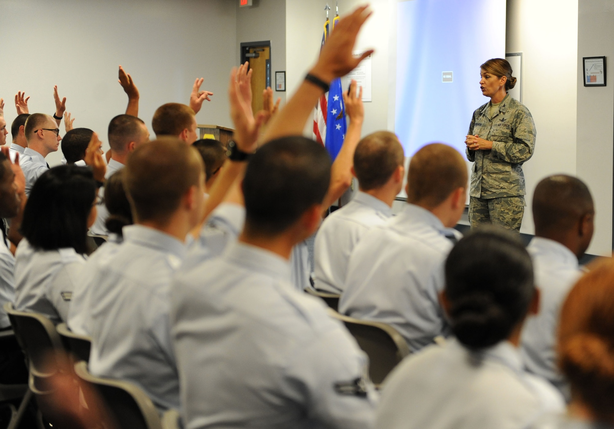 Col. Michele Edmondson, 81st Training Wing commander, welcomes non-prior service Airmen to Keesler during their in-processing at the Levitow Training Support Facility July 2, 2016, on Keesler Air Force Base, Miss. Base leadership welcomes the new Airmen every Tuesday upon their arrival from enlisted basic military training at Lackland Air Force Base, Texas. (U.S. Air Force photo by Kemberly Groue/Released)