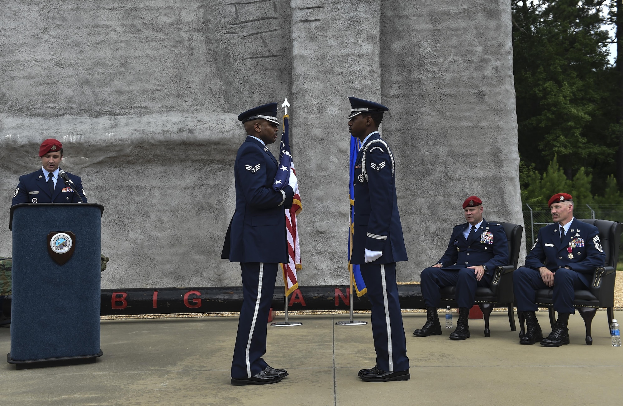 The Pope Army Airfield Base Honor Guard perform an American Flag to mark Chief Master Sgt. Marshall Farris’s, Headquarters Air Force combat control functional manager, retirement during a ceremony at the Combat Control School on Pope Army Airfield, N.C., Aug. 5, 2016. Farris deployed 12 times and participated in 33 joint-partner operations in support of combat control missions spanning a 30-year career. (U.S. Air Force photo by Senior Airman Ryan Conroy)