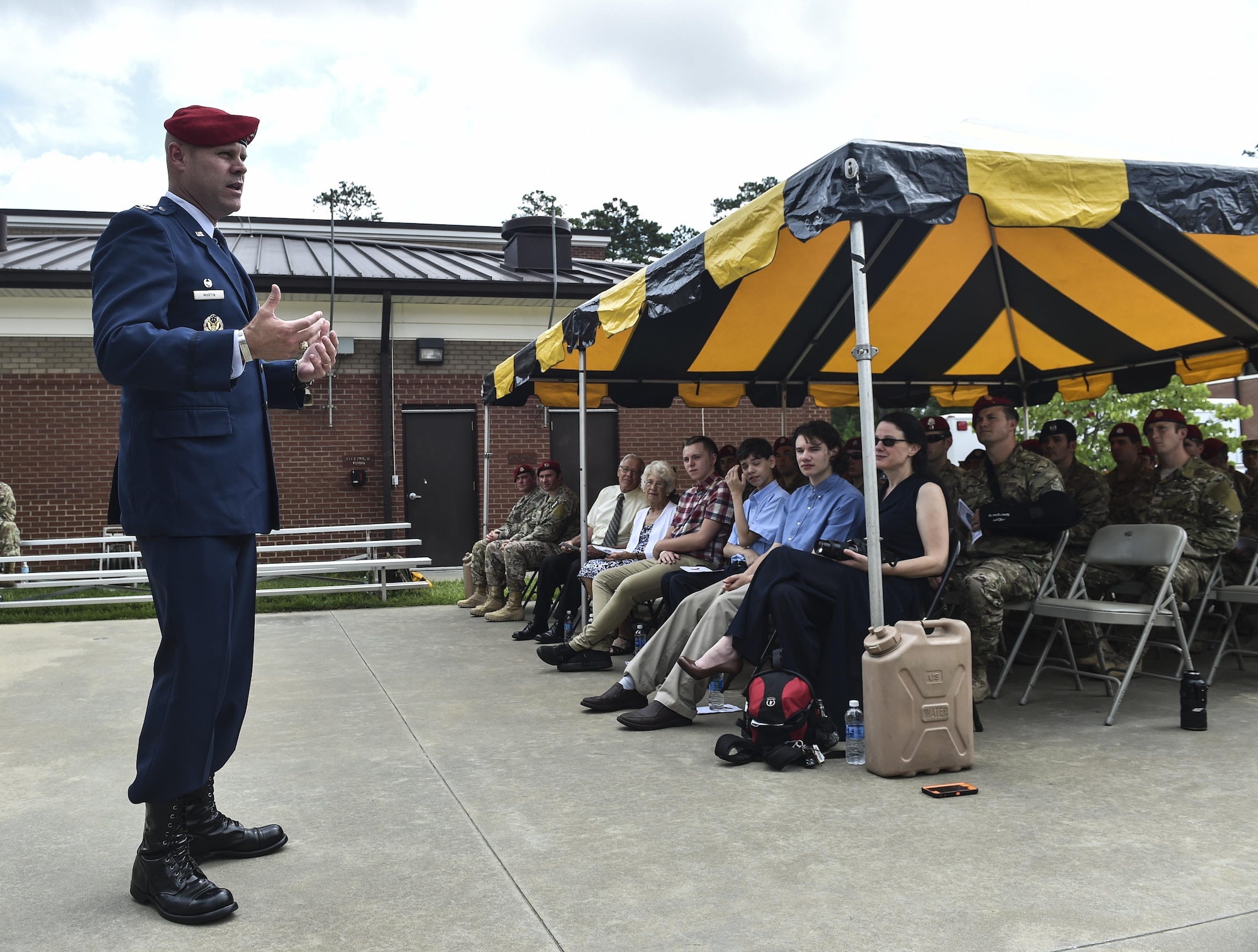 Col. Michael Martin, commander of the 24th Special Operations Wing, speaks during Chief Master Sgt. Marshall Farris’s, Headquarters Air Force combat control functional manager, retirement ceremony at the Combat Control School on Pope Army Airfield, N.C., Aug. 5, 2016. As the combat control functional manager, Farris was responsible for the leadership and training of more than 600 combat control Airmen -- managing force structure, manning programs and recruiting to ensure CCT forces were available and mission ready. (U.S. Air Force photo by Senior Airman Ryan Conroy)